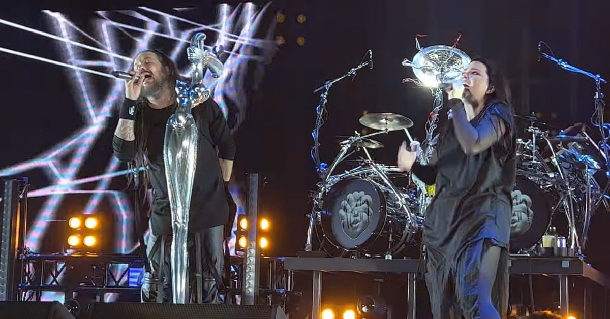 A screenshot of a live performance by Korn and Amy Lee.