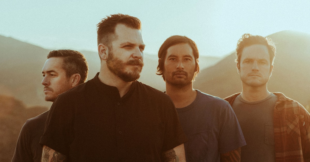 A photo of Thrice standing in the sun.