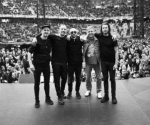 A black and white photo of Architects in an arena