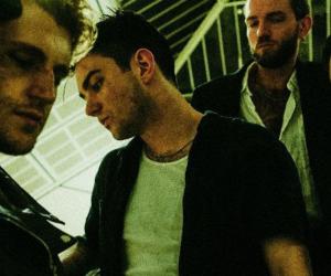 Thornhill photographed standing in a group, next to a stairwell