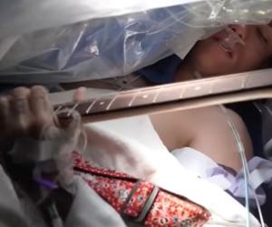 Christian Nolen plays guitar while underdoing brain surgery at University of Miami, Photo Credit - UHealth