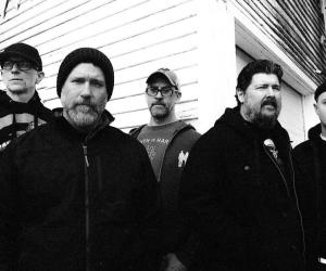 A black and white photo of Hot Water Music 
