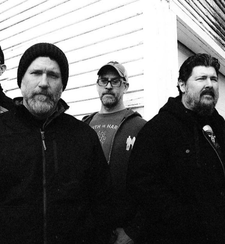 A black and white photo of Hot Water Music 